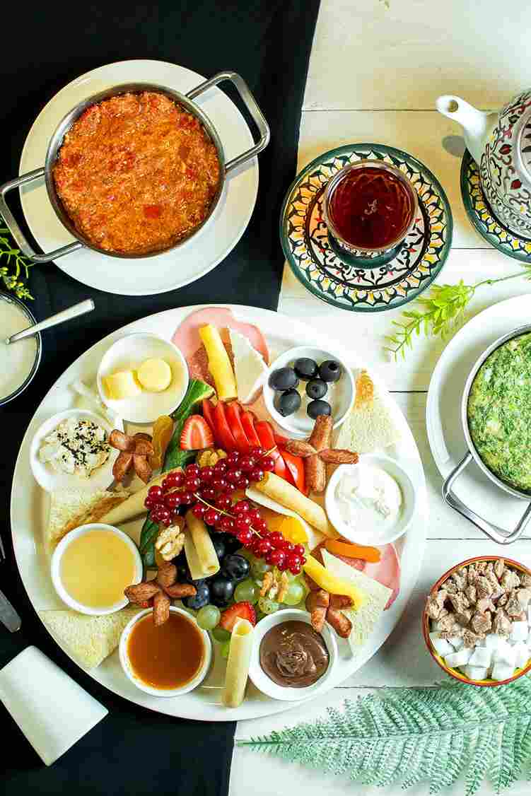 top-cheese-plate-served-with-sauces-grapes-fresh-fruits-scaled_11zon